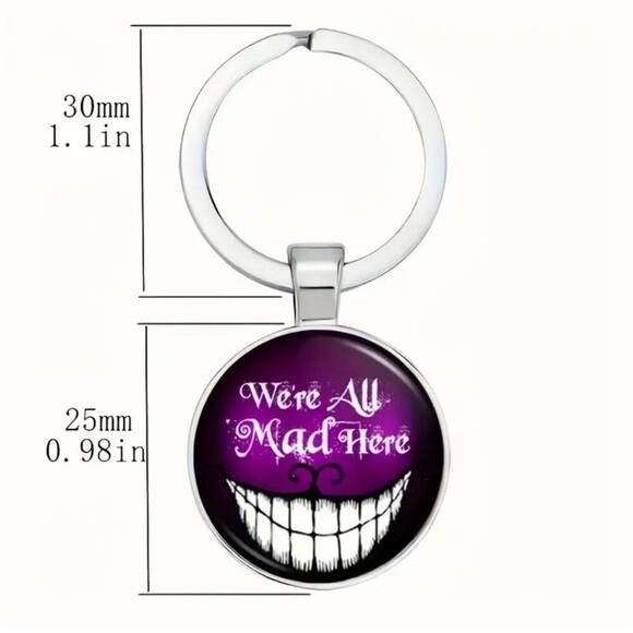 Cheshire cat smile, we are all made here glow in the dark keychain - Picture 4 of 7
